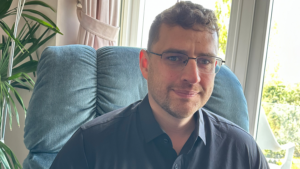 Joe smiles at the camera.