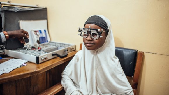 Rukayya sits having an eye test.